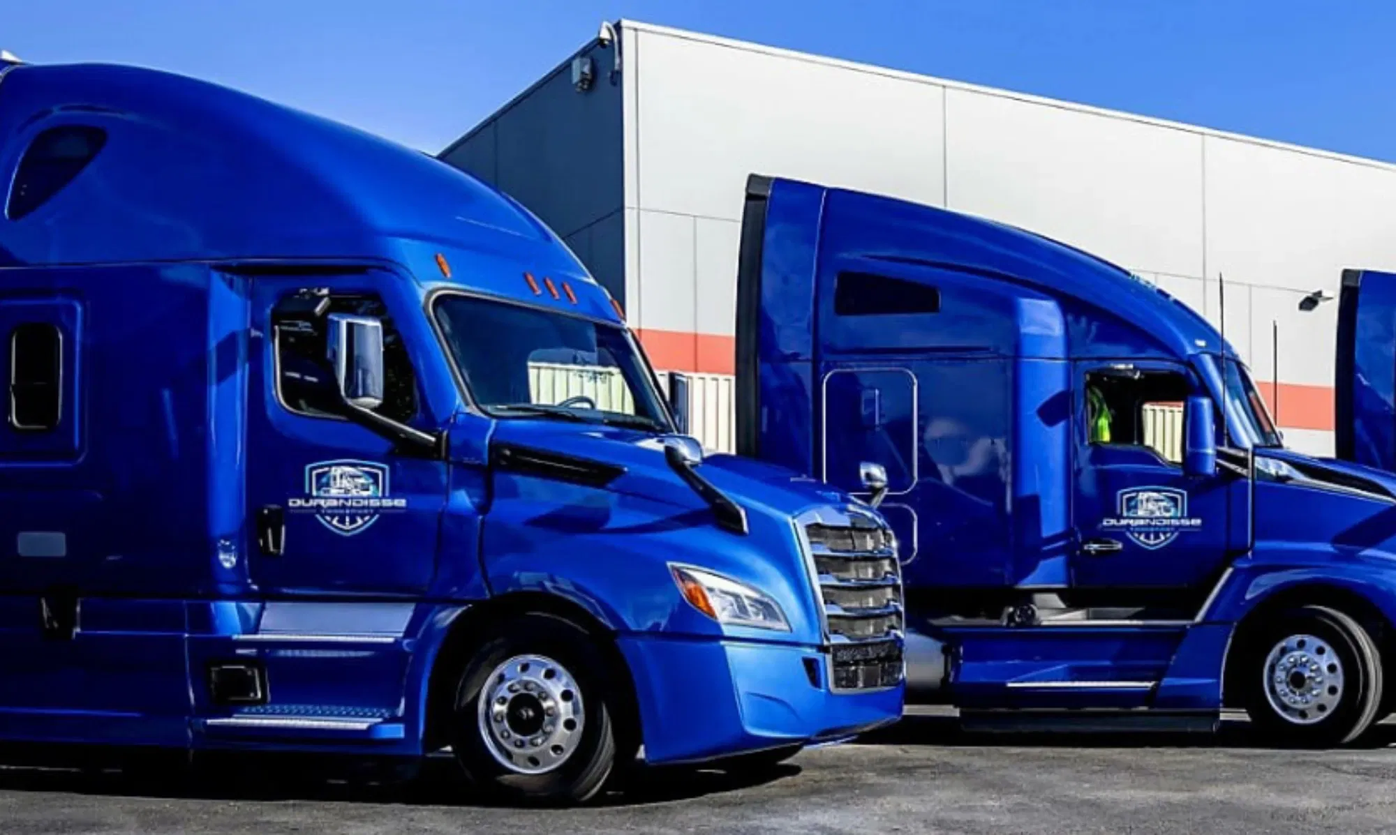 Durandisse blue tractor-trailers at a freight facility